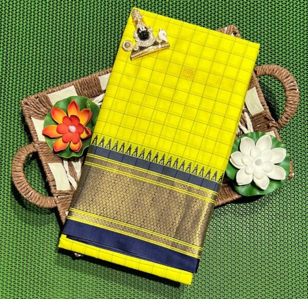 A luxurious Kanjivaram silk saree with intricate checks and butta designs in vibrant colors