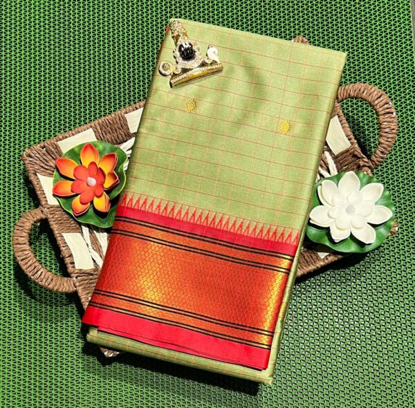 A luxurious Kanjivaram silk saree with intricate checks and butta designs in vibrant colors