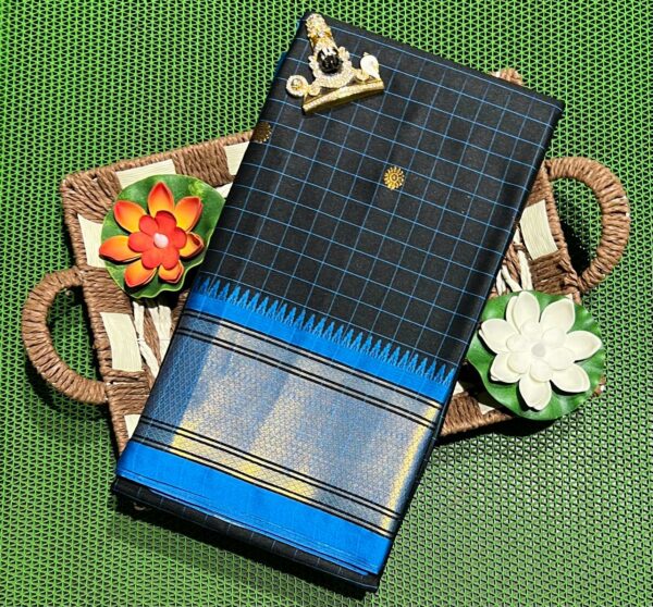 A luxurious Kanjivaram silk saree with intricate checks and butta designs in vibrant colors