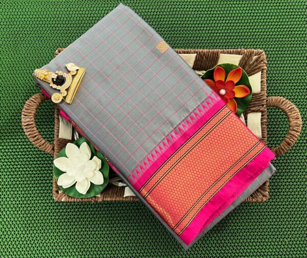 A luxurious Kanjivaram silk saree with intricate checks and butta designs in vibrant colors