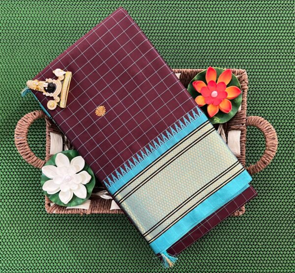 A luxurious Kanjivaram silk saree with intricate checks and butta designs in vibrant colors