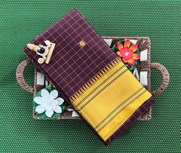 A luxurious Kanjivaram silk saree with intricate checks and butta designs in vibrant colors