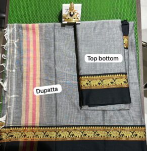 A beautiful Narayanpet half saree with intricate weaving patterns and vibrant colors.