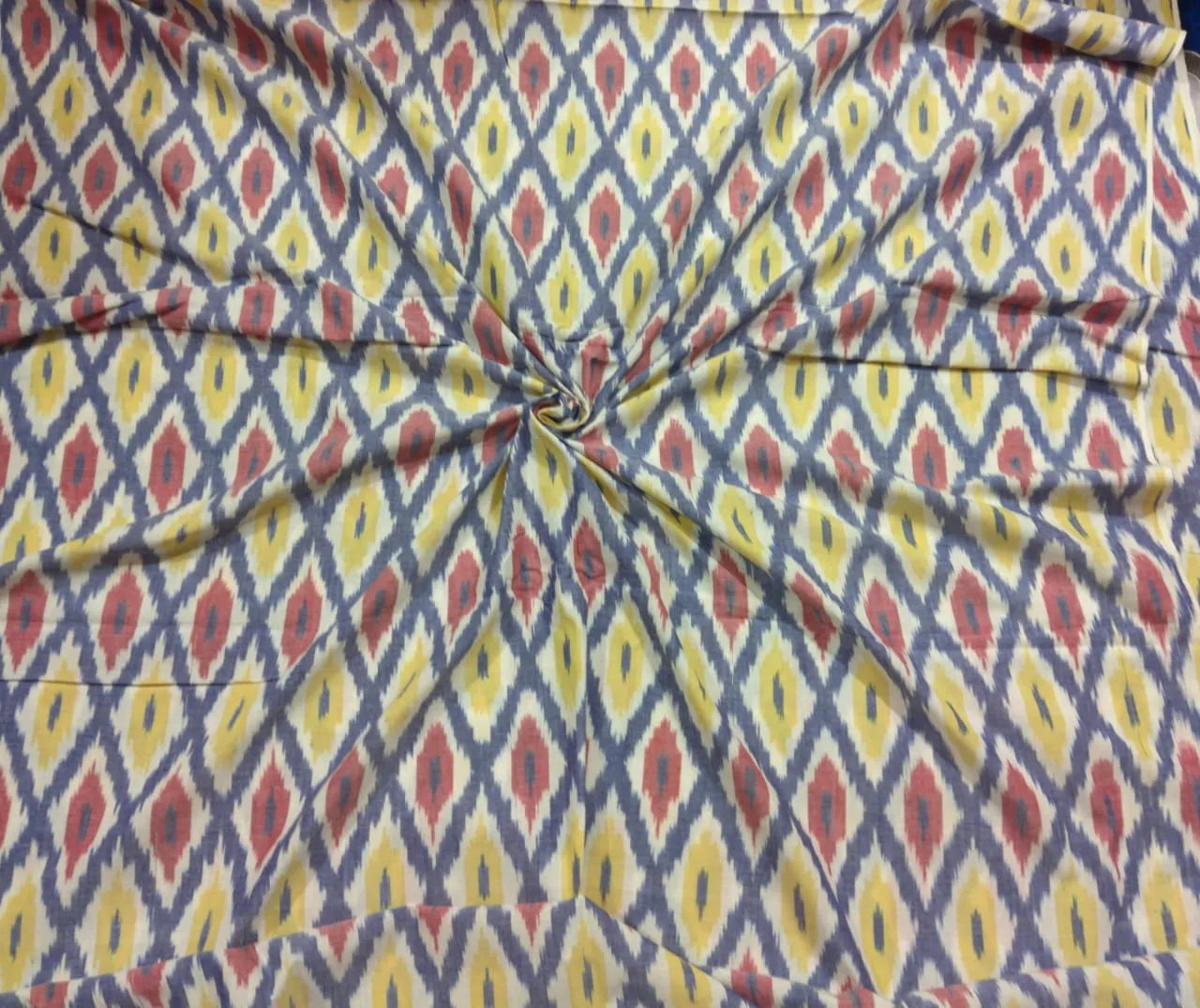 Colorful ikat pattern woven fabric in shades of red, yellow, and blue, spread out and twisted in the center to showcase the intricate design, 45-inch width, from PAVANKUMARWEAVES."