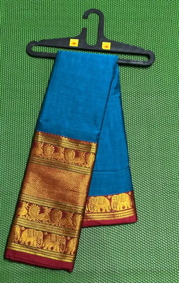 A turquoise blue Narayanpet sarees with a thick, golden border featuring elephant motifs.