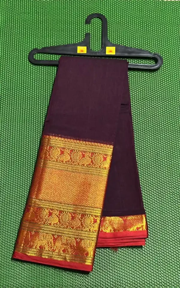 A rich maroon Narayanpet cotton saree with a thick golden border featuring elephant motifs and a red inner border.