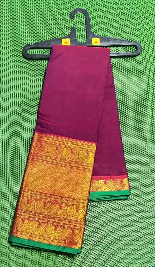 A maroon Narayanpet sarees with a thick, golden and green border featuring traditional motifs.
