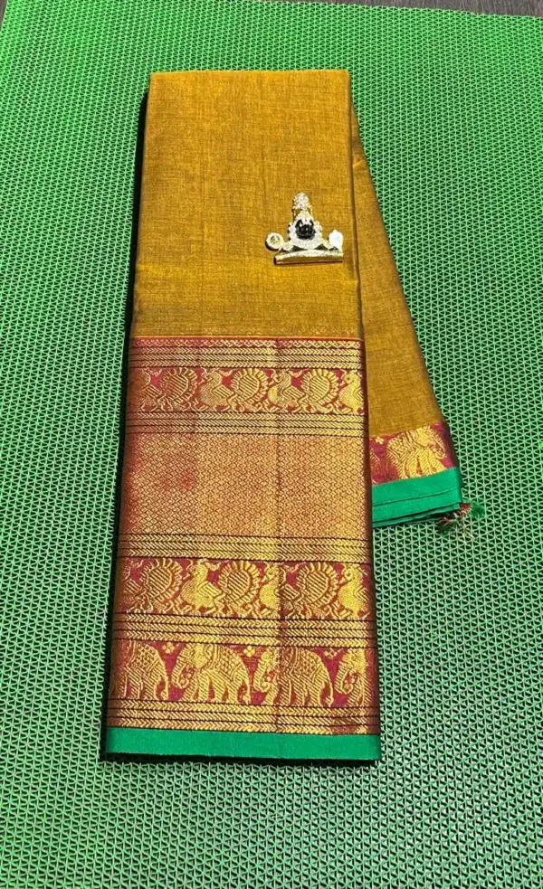 Golden Narayanpet sarees with a green border, featuring intricate gold elephant motifs.