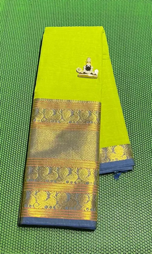 Handwoven Narayanpet cotton saree featuring a bright green base, a contrasting blue border, and gold zari accents