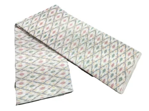 silk fabric with a traditional ikat pattern featuring multicolored diamond motifs arranged in a symmetrical design."