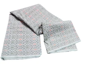 cotton silk fabric with a traditional ikat pattern featuring multicolored diamond motifs arranged in a symmetrical design."