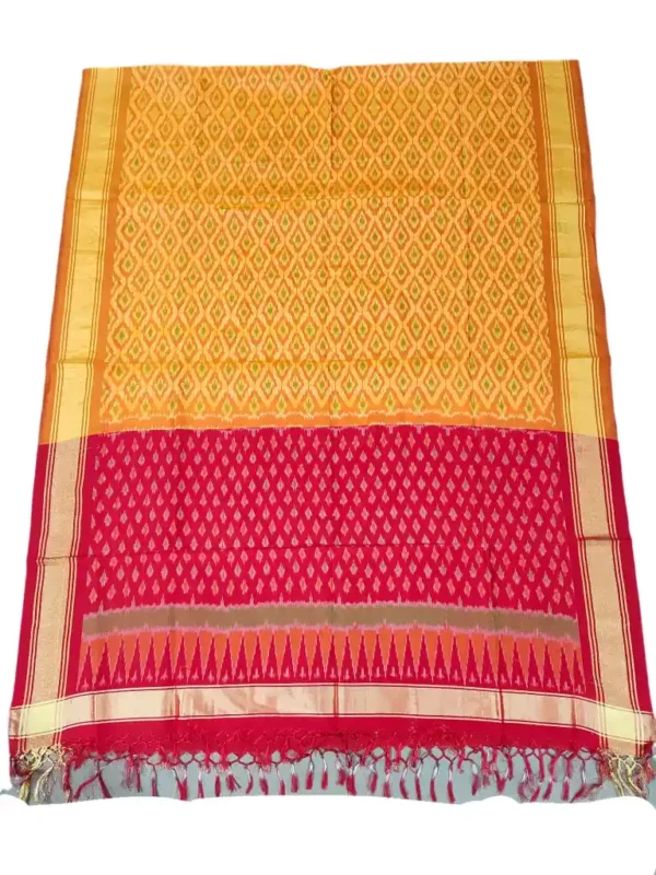 Pochampally Ikat COTTON silk suit with intricate handloom weaving patterns, showcasing traditional geometric designs, bordered with rich detailing.