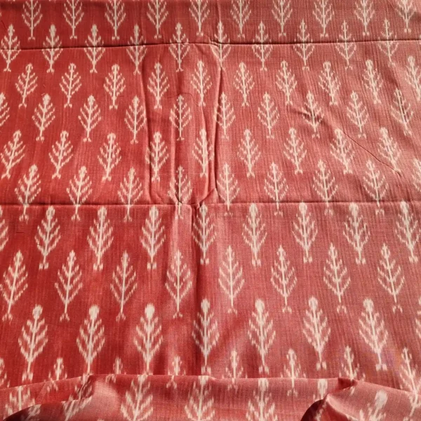 Handloom ikat fabric in green and white, showcasing fine craftsmanship and cultural heritage