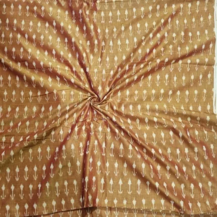 Tie and dye cotton fabric with intricate ikat patterns on a loom